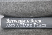 Between A Rock And A Hard Place